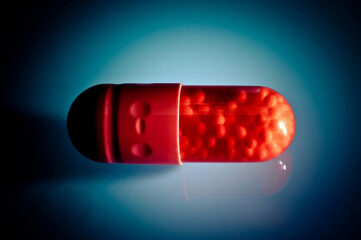 photo of a red pill capsule