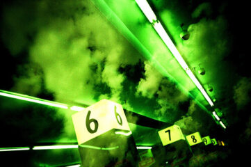 cloudy green photo of aisle numbers in a store