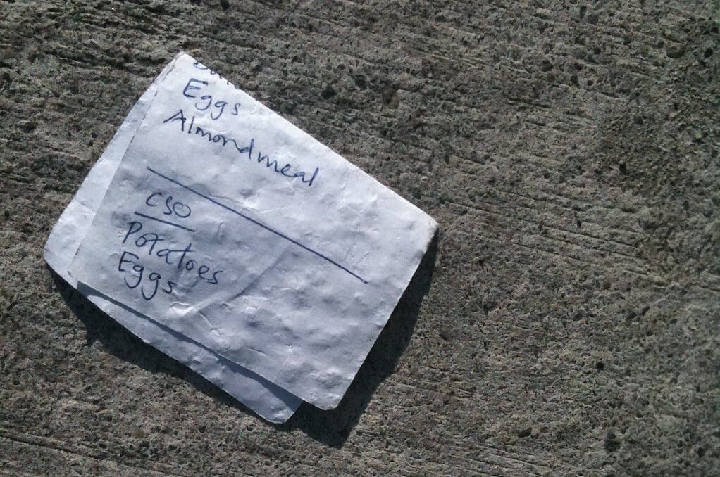 photo of discarded grocery list on the ground