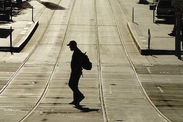 dispossessed trucker walking on empty street